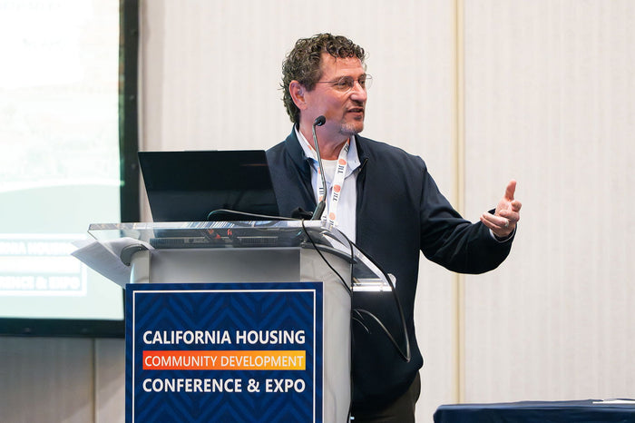 A speaker at the 2025 California Housing & Community Development Conference
