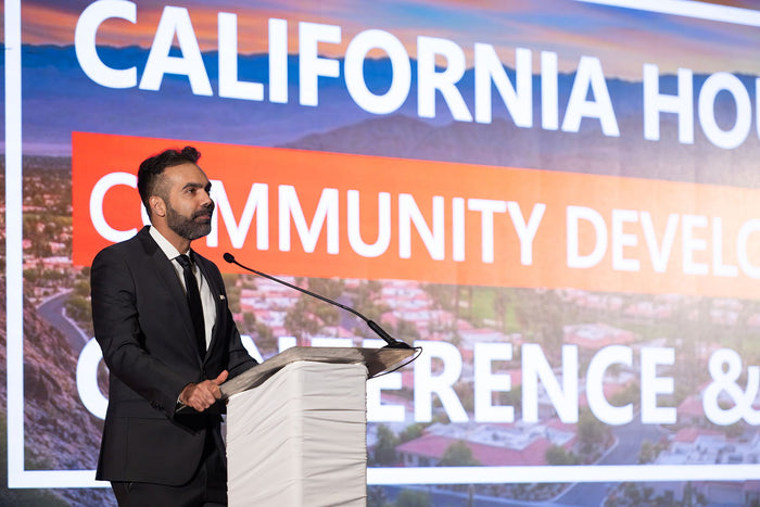 A speaker at the 2025 California Housing & Community Development Conference