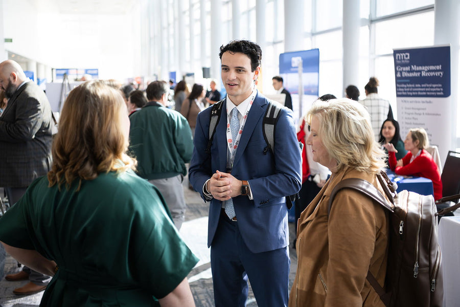 Attendees networking at the conference