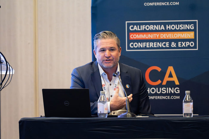 A speaker at the 2025 California Housing & Community Development Conference